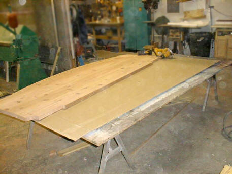 we create a redwood blank by laminating two sheets of conheart redwood, gluing & dowelling all joints, sanding the surface smooth, and then cutting to shape.